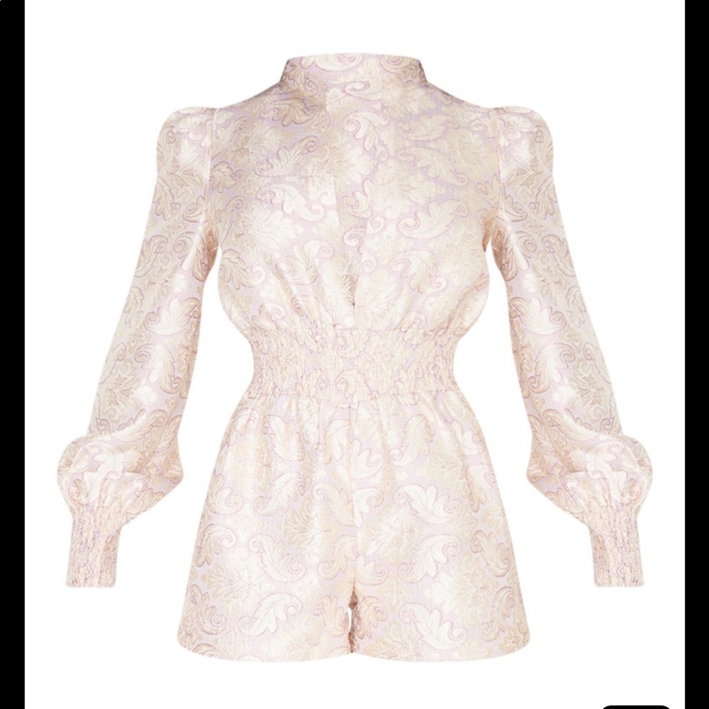 Brand New with tags. Pretty little thing romper